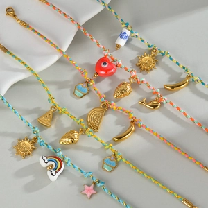 Handmade colorful woven rope bracelets with gold strawberry and banana pendants for women