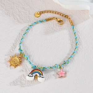 Detail of woven rope bracelet with colorful enamel sun rainbow and star charms