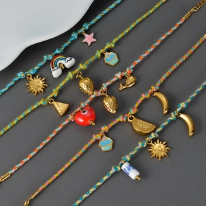 Colorful hand-woven fruit charm bracelets with gold pendants and vibrant summer cords
