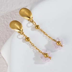 Detail of beaded flower earrings with gold shell studs and pink crystal petals