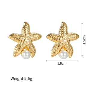 Detail shot of starfish pearl earrings with dimensions and weight info in golden texture