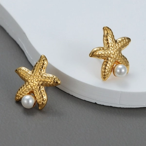 Starfish stud earrings with pearls and gold-plated textured finish for a coastal look
