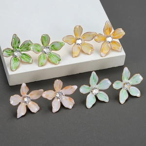 Chic enamel flower stud earrings with crystals in vibrant green, orange, and pink colors