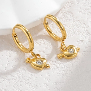 Macro view of 18K gold plated hoop earrings with heart shaped crystal drop detail