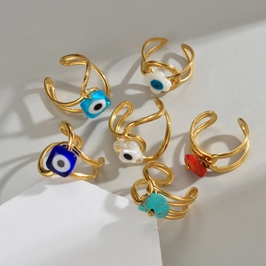 Set of six gold evil eye rings with colorful charms in minimalist double-line design