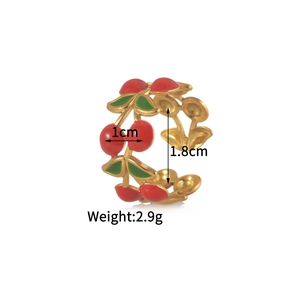 Detail view of cherry charm ring with red enamel and size dimensions 1cm and 1.8cm