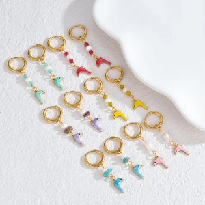 Golden hoop earrings set with colorful enamel dolphins and beads in various vibrant shades