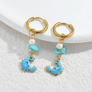 Detail of ocean-themed earrings featuring blue enamel crabs, pearls and turquoise beads