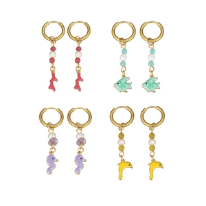 Golden hoop earrings set with colorful ocean charms like seahorse, dolphin and fish