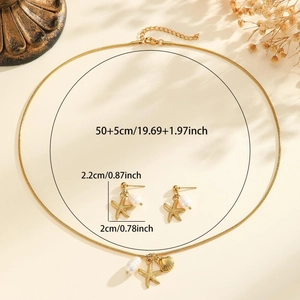 Golden ocean jewelry set with starfish pendants, shell motifs and pearls on a fine snake chain