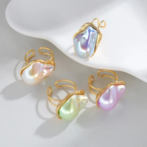 Set of four 18k gold stainless steel open rings featuring baroque style iridescent pearls
