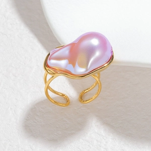 Detail of 18k gold stainless steel ring featuring a baroque iridescent pearl setting
