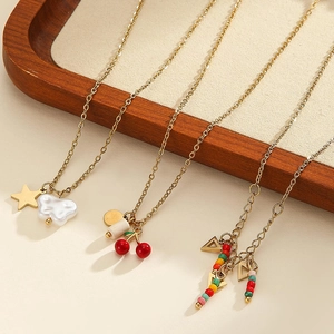 Chic gold-tone stainless steel necklaces with cherry, star, and colorful bead pendants