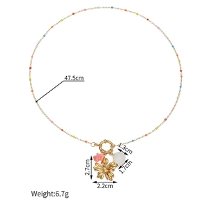 Ocean style necklace with gold chain, colorful beads, pink starfish and shell pendants
