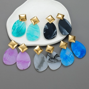 Five pairs of acrylic drop earrings with colorful marble texture and golden studs