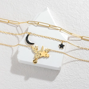 Three-layer stainless steel necklace featuring moon and star pendants with black zircons