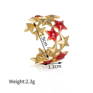 Detailed view of golden double-layer star ring with red enamel and measurement specs