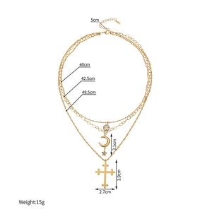 Detail showing dimensions of layered stainless steel gold necklace with cross and moon charms
