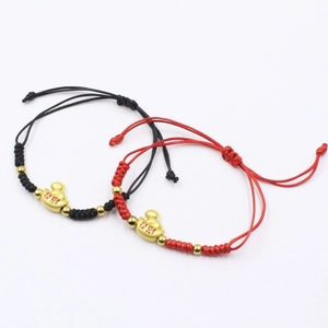 Handmade woven red and black string bracelets with golden yuanbao charms for luck