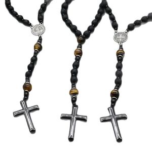 Lava stone and tiger eye beaded religious necklace featuring a silver cross pendant
