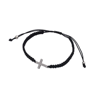 Close-up of black braided rope bracelet with silver cross pendant and adjustable drawstring