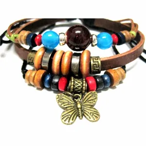 Detail of bohemian multilayer leather bracelet with colorful beads and butterfly charm