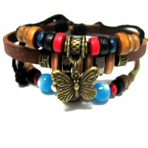 Detail of multi-layer leather bracelet with colorful wood beads and metal butterfly charm