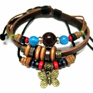 Detail of bohemian multilayer leather bracelet featuring colorful beads and butterfly charm