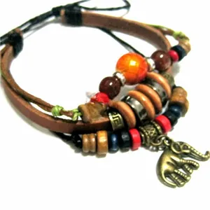 Detailed close-up of Bohemian multilayer leather bracelet with colorful beads and bronze charm