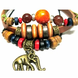 Close-up of bohemian multilayer leather bracelet with colorful beads and elephant charm