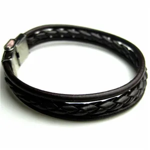 Detail shot of men's multi-layer woven leather bracelet with magnetic steel clasp