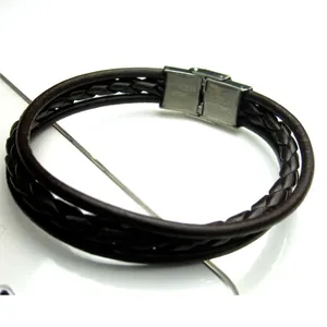 Detailed macro of men's dark brown triple braided leather bracelet with steel magnetic clasp