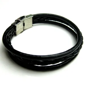 Macro shot of the black braided leather multi-layer bracelet with silver metal clasp