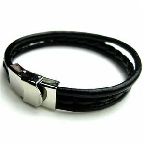 Macro shot of multilayer black woven leather bracelet with silver magnetic clasp