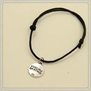 Adjustable black wax cord figure skating charm bracelet with polished round metal pendant