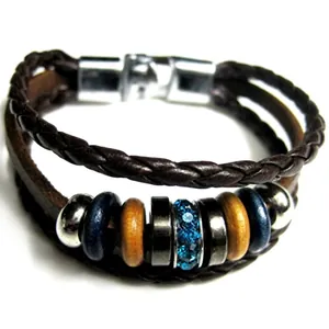 Detail of multi-layer braided leather bracelet with star nautical anchor and wood beads
