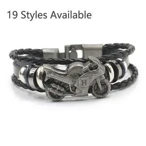 Macro detail of multi-layer leather motorcycle bracelet with vintage metal charm
