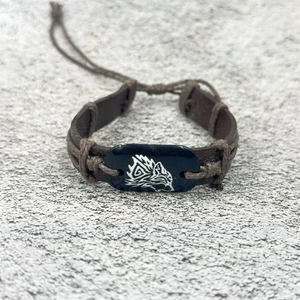 Retro adjustable leather bracelet with a tribal wolf head design in deep brown finish