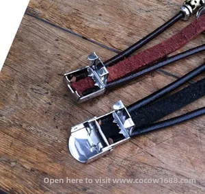 Detail of the adjustable metal buckle on multi-layer leather bracelets with trimming feature
