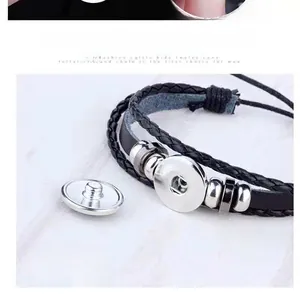 Detail of adjustable snap button closure on multi-layer woven leather constellation bracelet