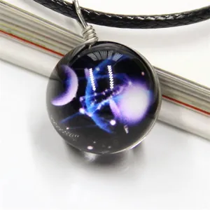 Macro detail of cosmic nebula glass pendant with artistic 3D galaxy patterns and wire wrap
