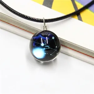 Macro shot of dreamlike galaxy sapphire glass ball necklace with handcrafted wire wrapping