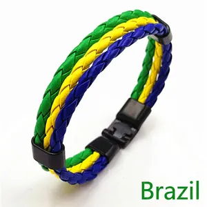 Detail of multi-layered braided leather bracelet in Brazil flag theme with a matte buckle