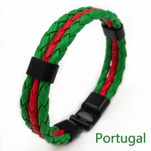 Close-up of handmade green and red woven leather bracelet with black buckle closure