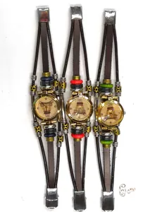 Detail of vintage multilayer leather watches with Eiffel Tower dials and colorful beads