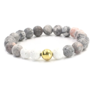 Matte zebra stone and volcanic rock beaded bracelet with a polished gold metal charm