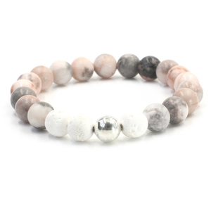 Pink zebra stone and natural lava bead bracelet with silver accent on white background