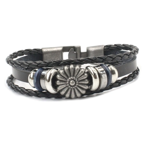 Detail of multi-layer braided leather bracelet with vintage silver daisy metal ornament