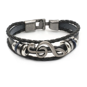Multilayer black leather bracelet featuring a vintage silver music G-clef metal charm
