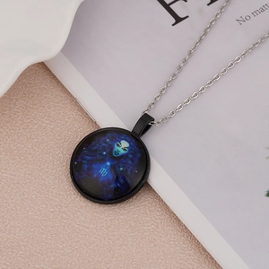 Detail of Virgo constellation necklace pendant with purple galaxy glass and silver chain